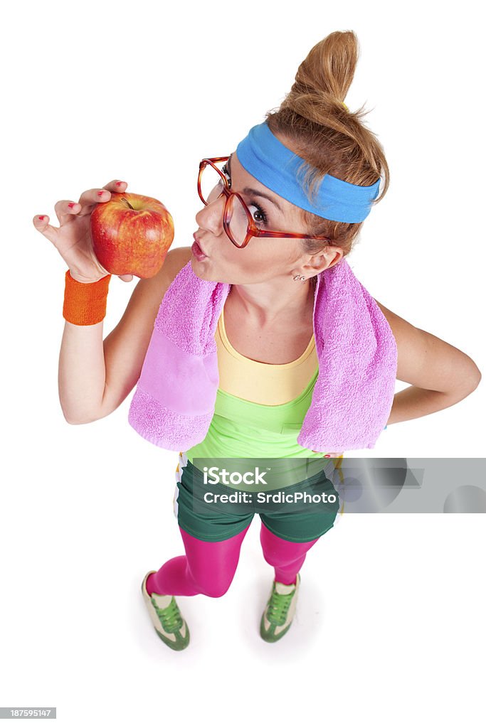 Funny girl wearing deportes es holdin manzana roja de tela - Foto de stock de 20 a 29 años libre de derechos