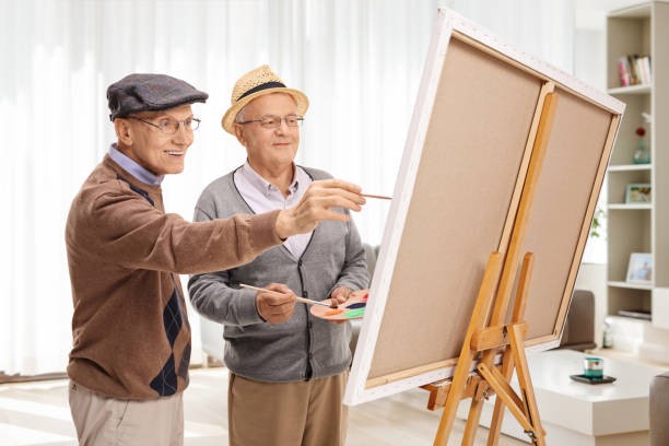 istock Elderly men painting on a canvas 1875953531