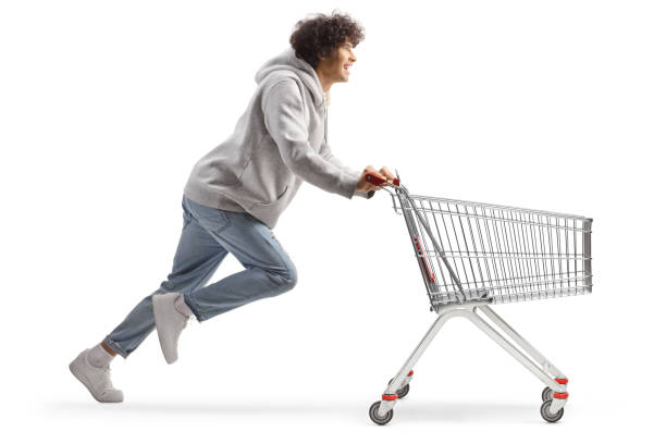 istock Young man running with a shopping cart 1875954076