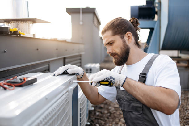 istock Repairman fixing conditioner using screwdriver on roof 1875959392