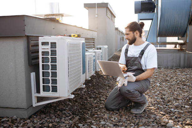 istock Man worker using laptop and servicing conditioner outdoor 1875959408
