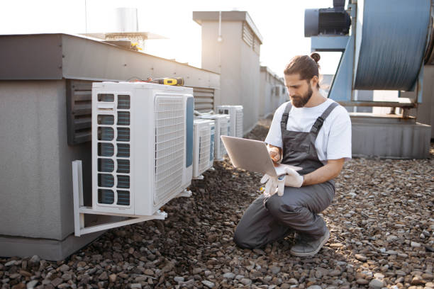 istock Man worker using laptop and servicing conditioner outdoor 1875959419