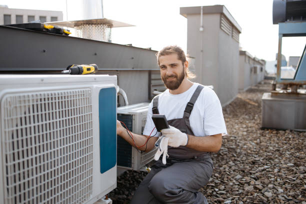 istock Builder man applying voltage tester to conditioner outdoor 1875959422