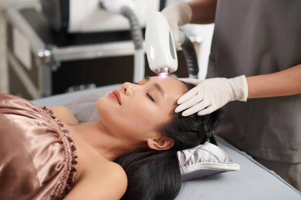 istock Woman Getting Forehead Hair Removal 1875960814