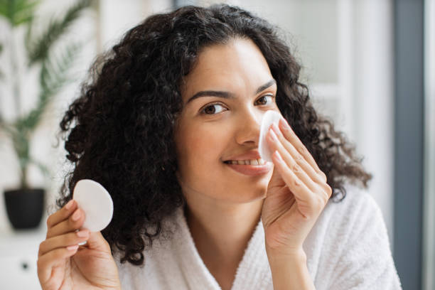 istock African woman removing cosmetics from nose area 1875961088