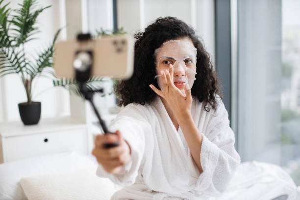istock African female during cosmetic online video class at home. 1875962178