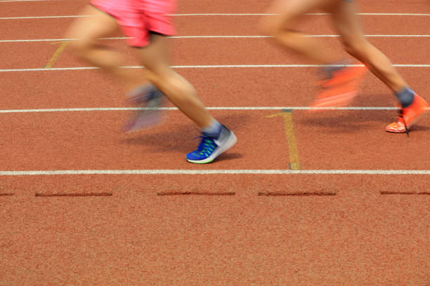 Low Section Of Athlete Running On Track