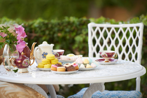 A table decked out with tasty treats and tea