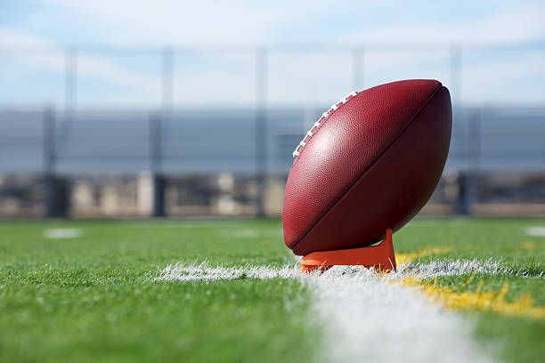 Pro Football teed up for kickoff Pro American Football ready for kickoff pigskin stock pictures, royalty-free photos & images