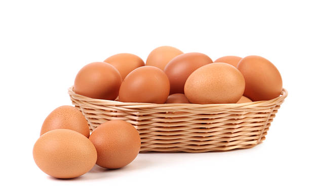 istock Brown eggs in the basket and near. 187602474