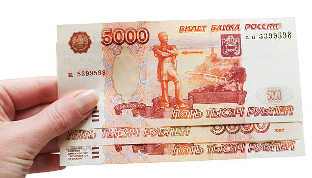 istock Hand with Russian money 187602659