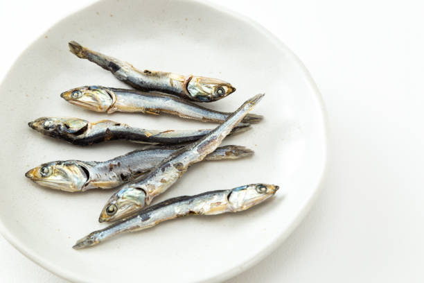 istock Dried sardines on a white background. 1876026750