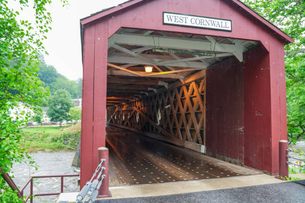 istock West Cornwall Covered Bridge. also known as Hart Bridge, is a wooden lattice truss bridge over the Housatonic River view from Sharon. 1876074525