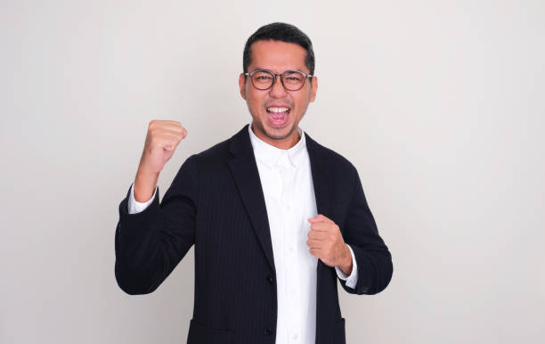 istock Asian businessman clenched fist showing optimist expression 1876079213