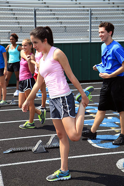 istock A group of teenagers stretching before a race. 187608948