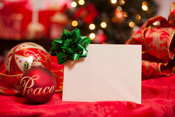 istock Blank Christmas card with holiday decor.  Tree in background. 187611167