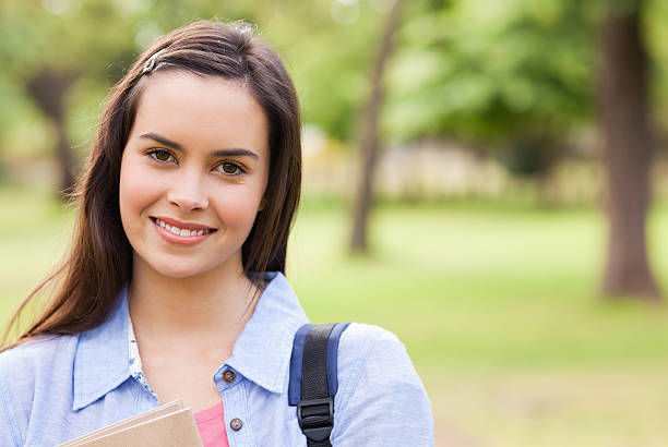 istock Portrait of a cute female student smiling 187611261