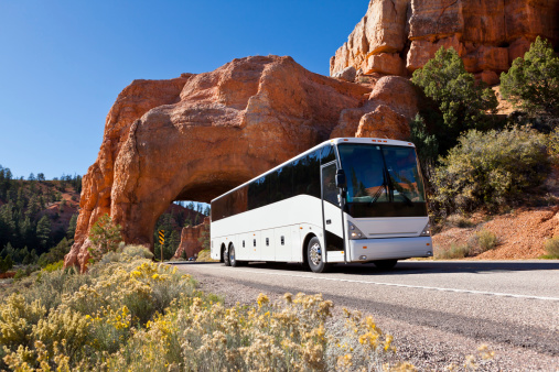 Bus driving through tunel Bryce Canyon USA