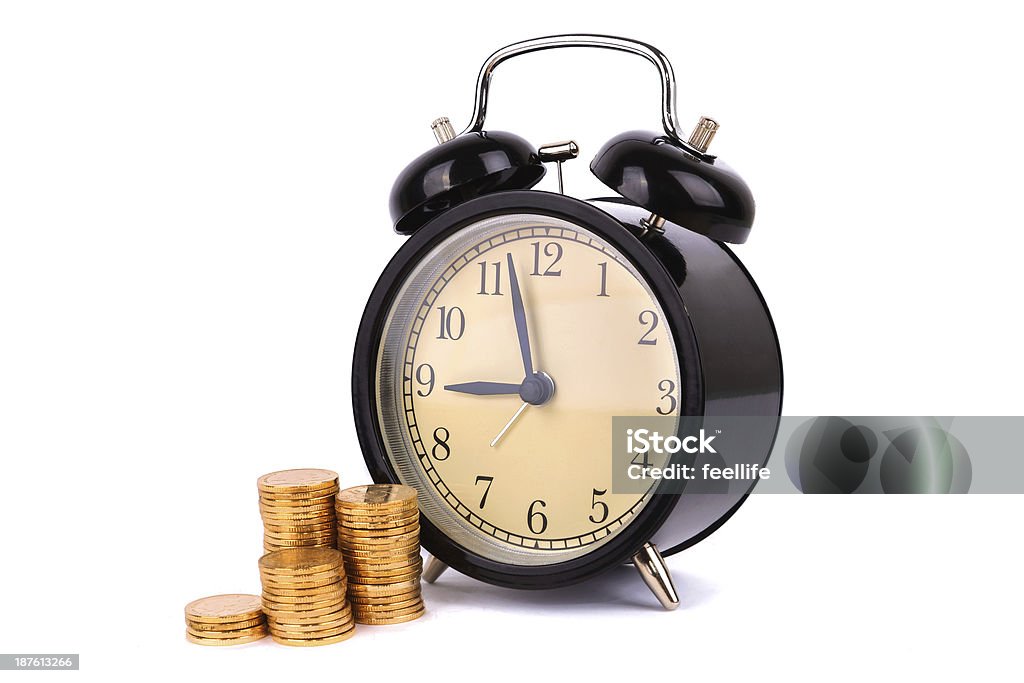 Time is money:alarm clock and coin isolated on white background Alarm Clock Stock Photo