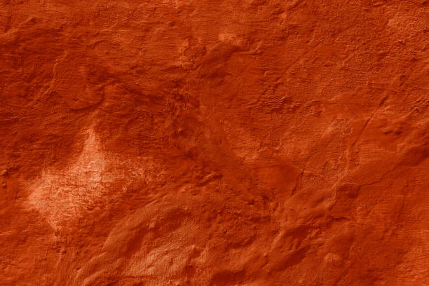 istock Grunge peach fuzz concrete background. Textured plaster wall. 1876143476