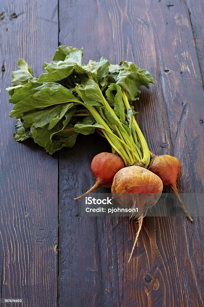 Golden Beets Golden beets on wood background.  Professionally shot, color corrected, exported 16 bit and retouched for maximum image quality. Beet Stock Photo