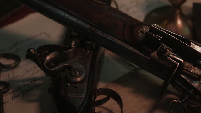 Closeup of old pistols on the ship
