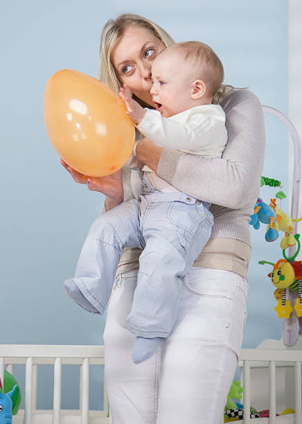 istock Mother Playing With Her Baby Boy 187616844