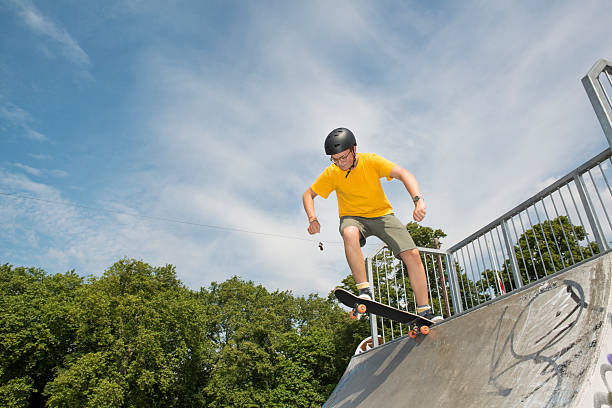 Female skateboarder grinding urban rails