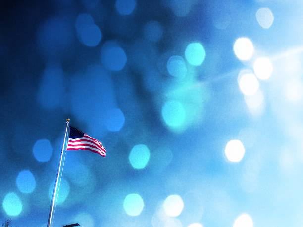 istock American Flag with sun shining through sparkles 187617082