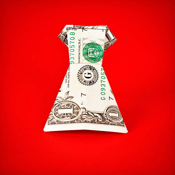 istock Dress allowance? Cute frock folded from US dollar bill 187617477