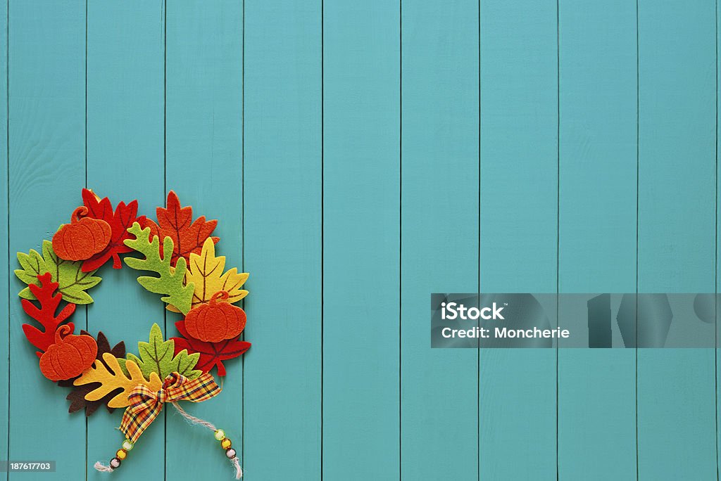 Autumn wreath with a pump copy space on turquoise woods Autumn Stock Photo