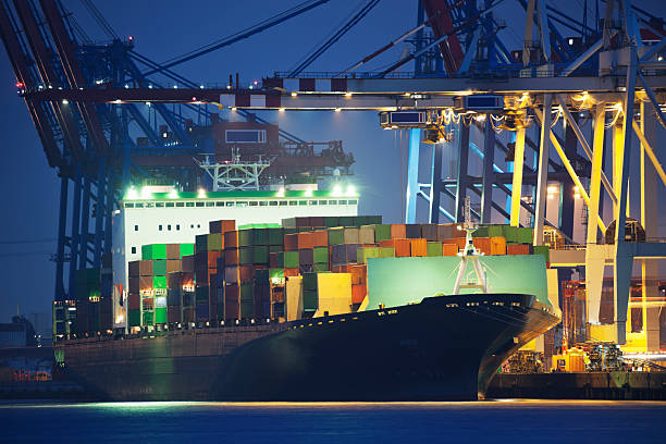 istock Large Container Ship Being Loaded at Night in Hamburg Harbour 187617777