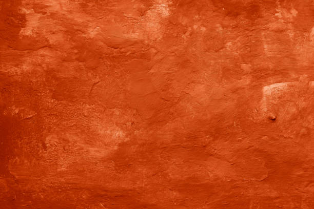 istock Grunge peach fuzz concrete background. Textured plaster wall. 1876180586