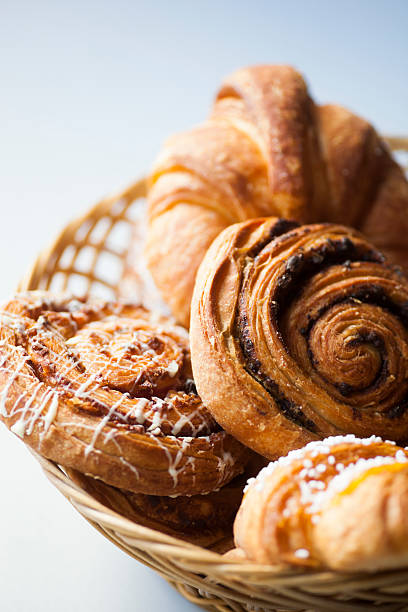 Variety of fresh bread and pastry in a basket