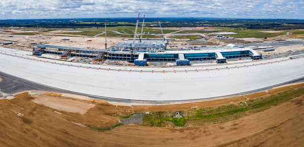 Panoramic aerial drone view of the construction site of the new Western Sydney International Airport at Badgerys Creek in Western Sydney, NSW Australia on a sunny day shot on 23 December 2023