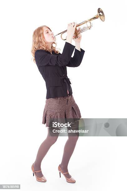 Young Pretty Woman Playing The Trumpet Stock Photo - Download Image Now - Trumpet, Women, One Woman Only