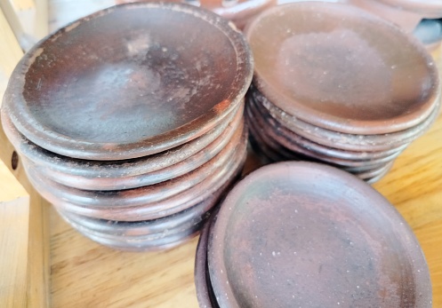 stack of plates made of clay
