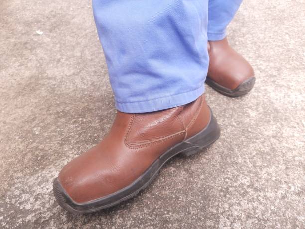istock a man wears safety shoes 1876198566