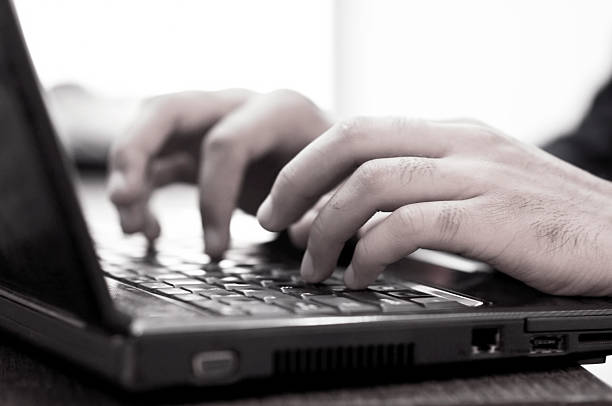 istock Businessman's hand typing on a laptop 187620298