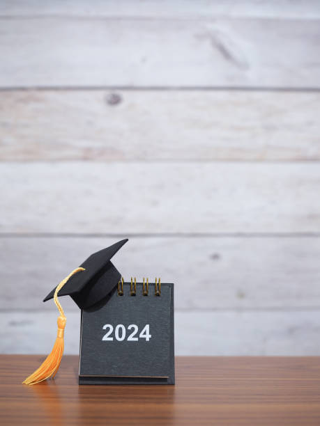 istock Study goals, 2024 Desk calendar with graduation hat. The concept for Resolution, Goal, Action, Planning, and manage time to success graduate. 1876220863
