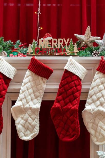 istock Christmas stockings and decorations at vertical composition 1876243644