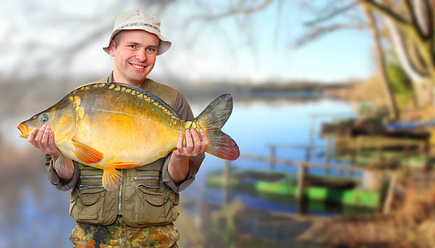 istock The fisherman with his big Carp. 187624622