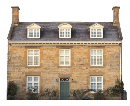 Cut-out Cotswold house on white background.