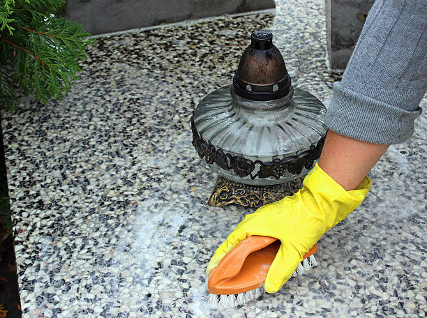 cleaning of the monument at cemetery stock photo