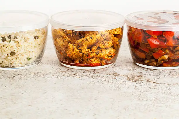 stir fry dinner meal or leftovers stored in glass containers