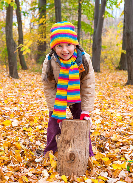 istock girl in autumn park 187629604