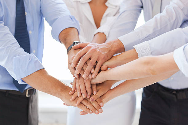 istock business team celebrating victory in office 187629640