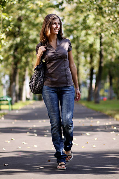 istock Full length, walking woman in autumn park 187632913