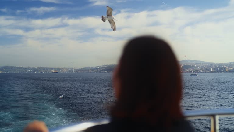 Asian female tourist traveling alone on ferry