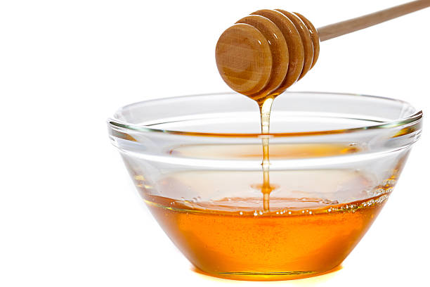istock Honey  with dipper and glass bowl 187633705